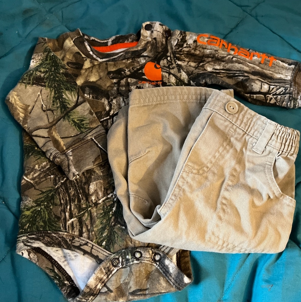 Size 6 month carhartt long sleeve camo onesie and 6 month old Disney tan pants